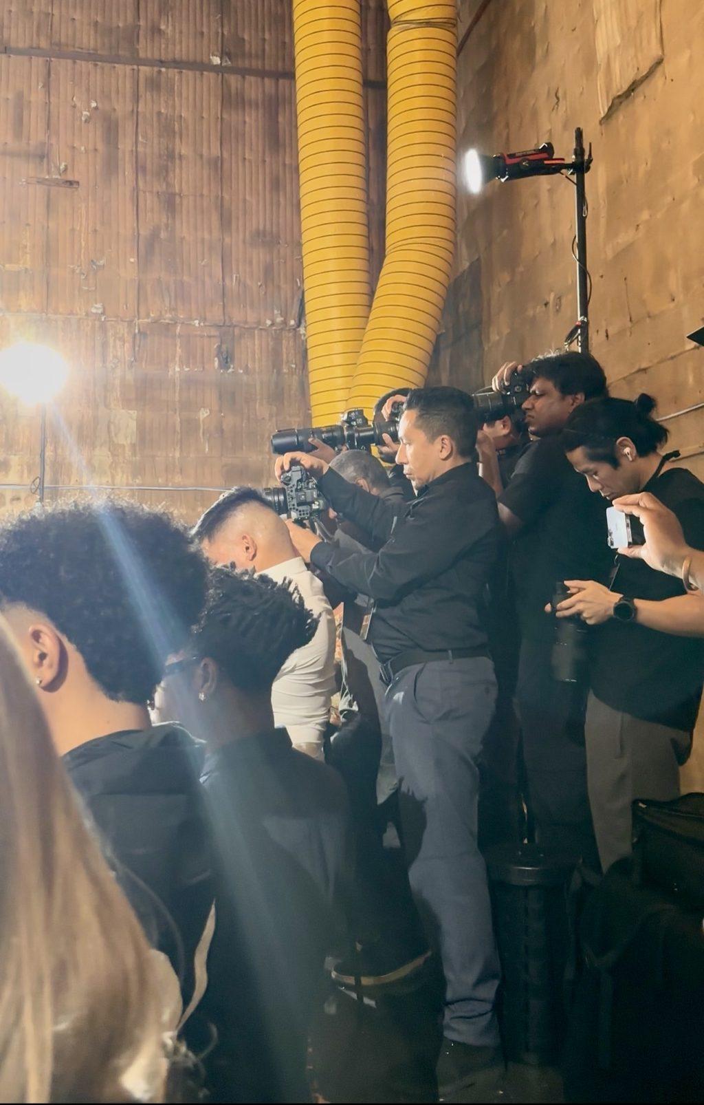 Photographers shooting from the pit at Los Angeles Fashion Week, October 2026
